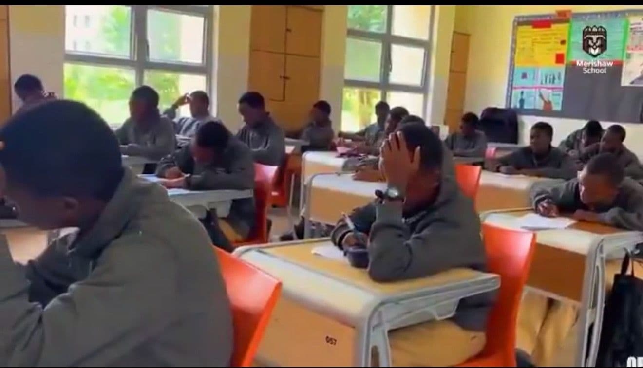 Precious Schools students completing an assessment in a classroom