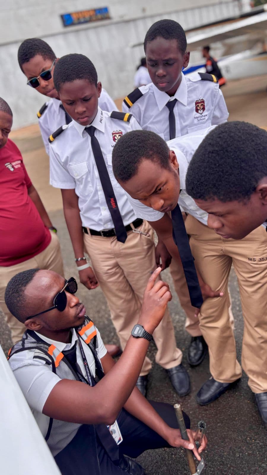 Precious Schools aviation students listening to a technical briefing