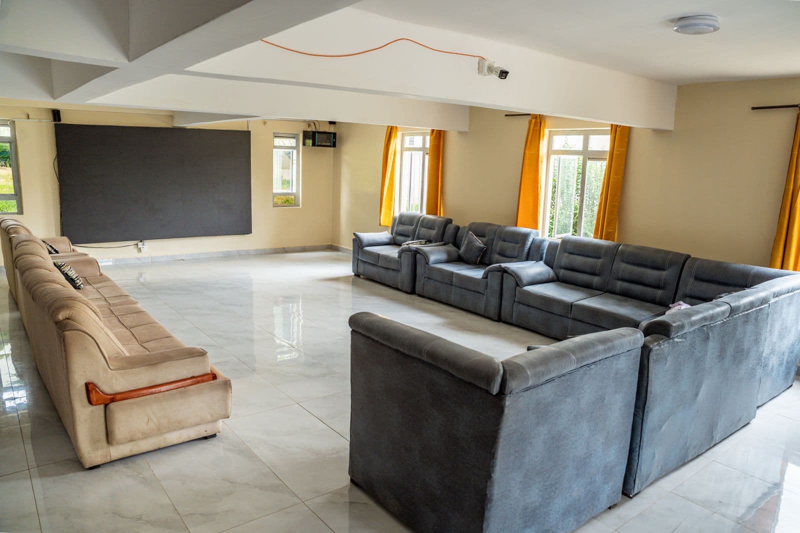 Precious Schools hostel common room with lounge seating