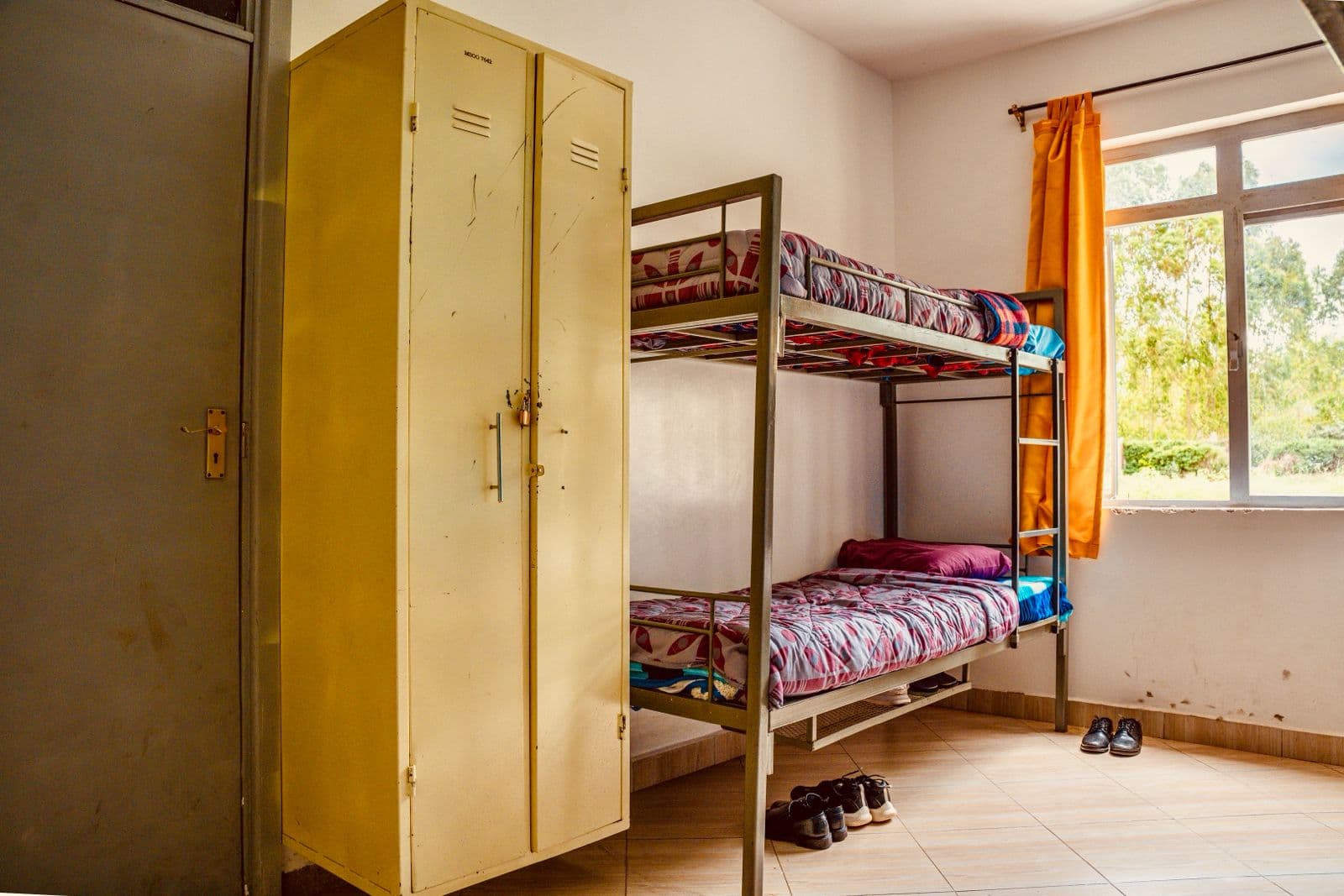 Precious Schools hostel room with bunk bed and student lockers