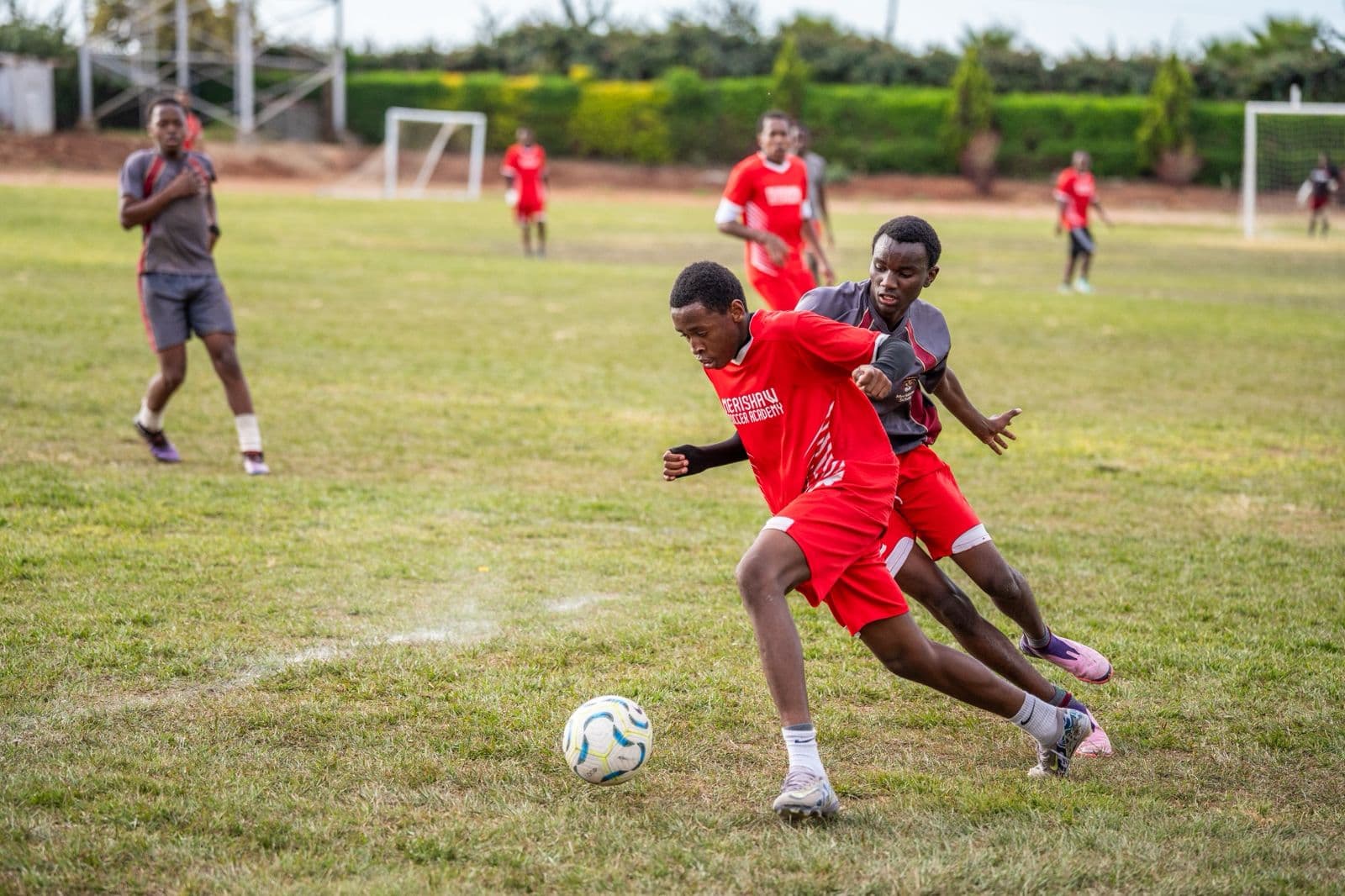 Precious Schools Soccer Academy students competing on the school field