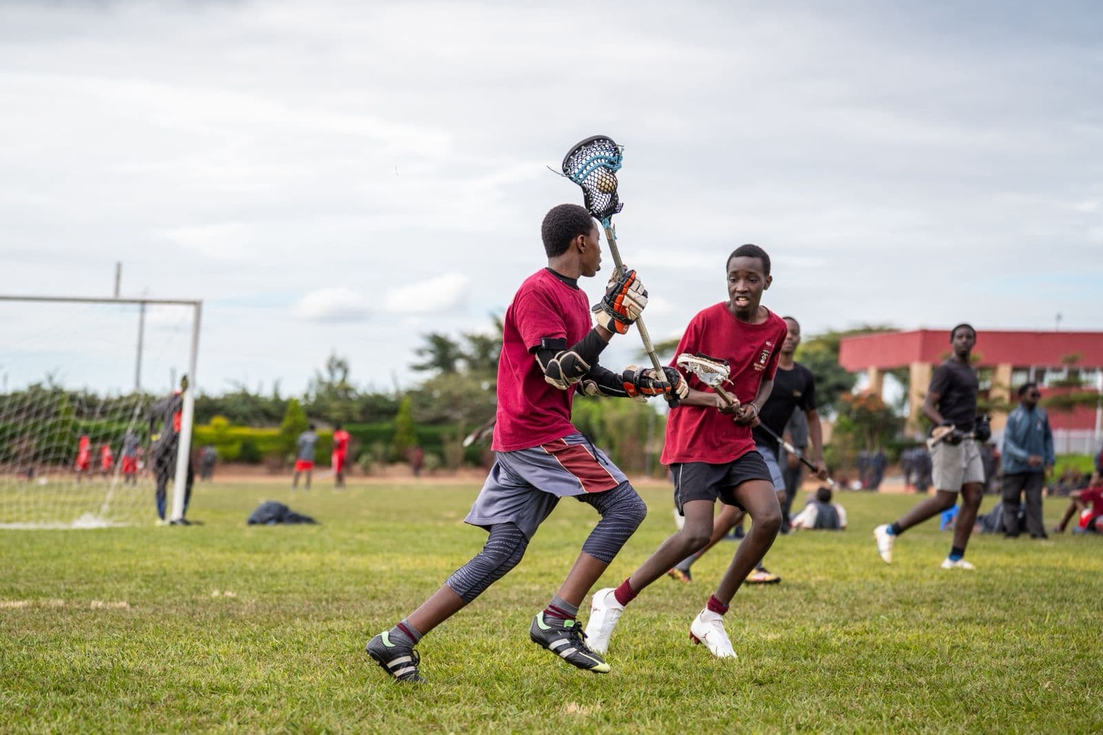 Precious Schools lacrosse students preparing a pass