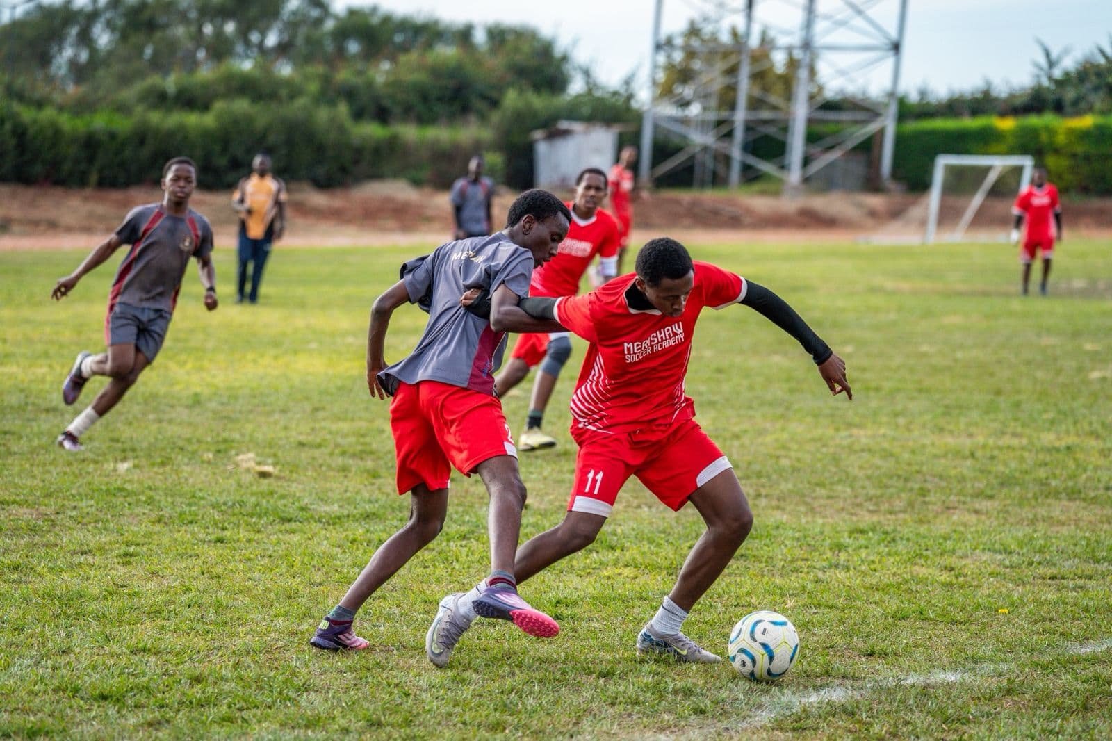 Precious Schools Soccer Academy students competing for the ball