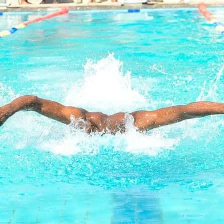 Precious Schools swimmer practising butterfly stroke