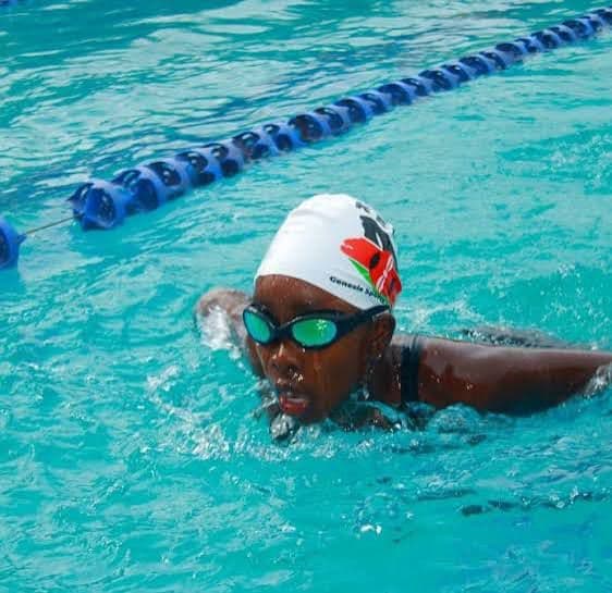 Precious Schools swimmer training in a pool lane