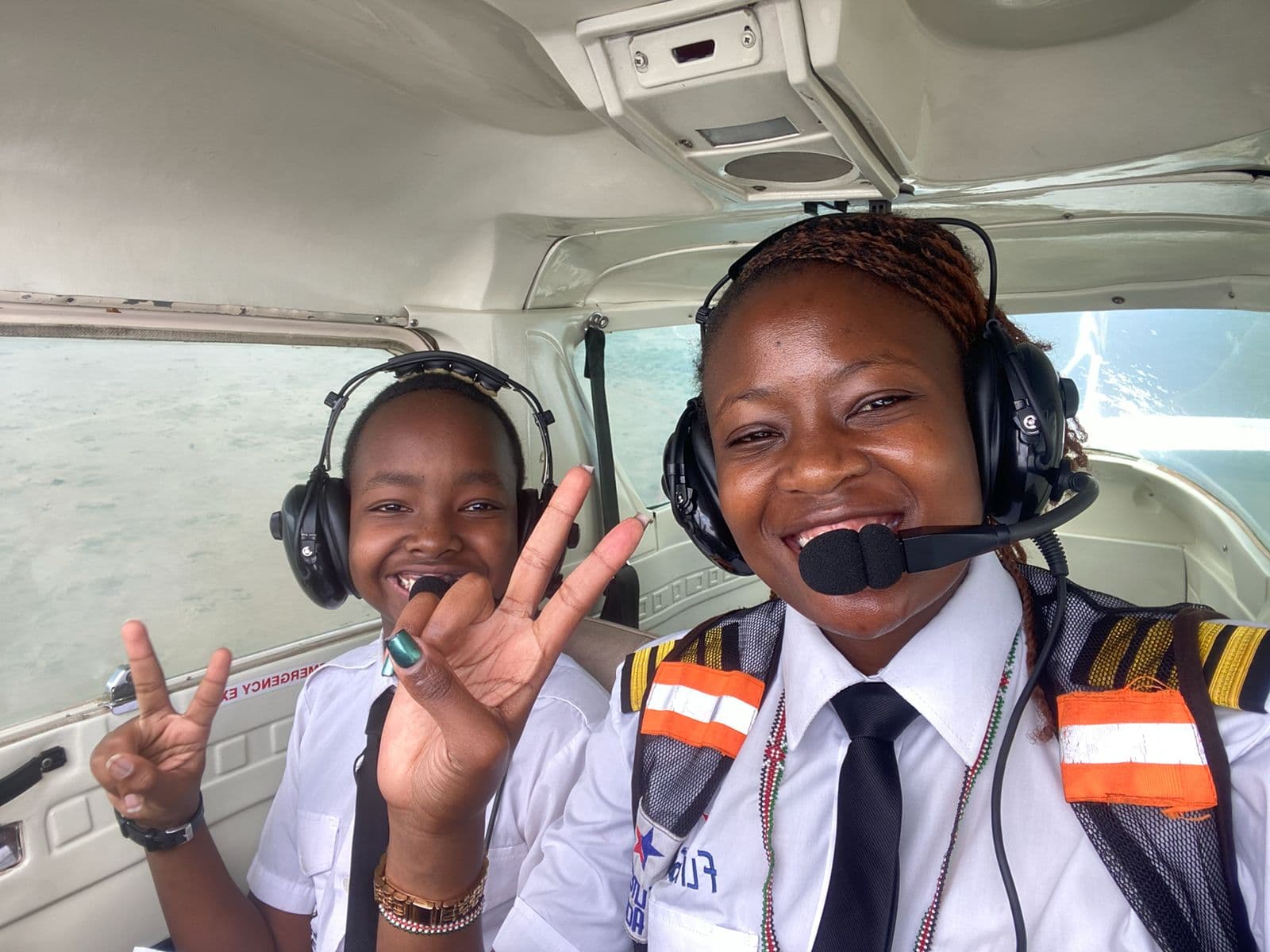A Precious Schools student and aviation mentor inside an aircraft