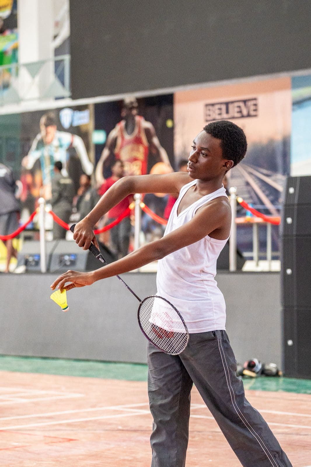 Precious Schools student preparing a badminton serve